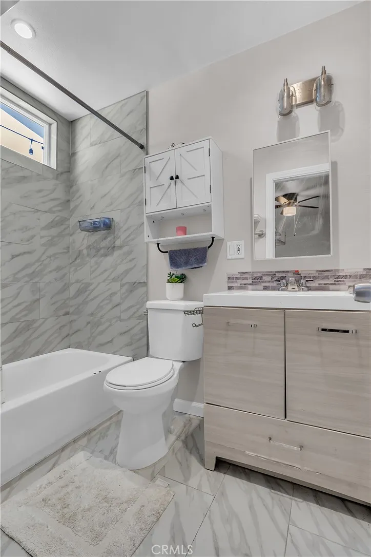 3738 Ahern Drive Baldwin Park, CA 91706 - Photo 18 of 36 a bathroom with a sink a toilet and a bathtub