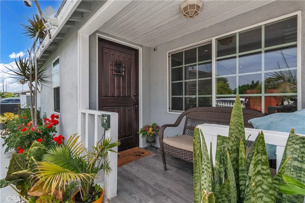 3738 Ahern Drive Baldwin Park, CA 91706 - Photo 2 of 36 a front view of a house with outdoor seating and flowers