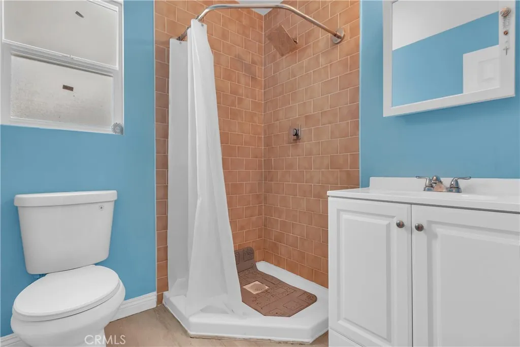 3738 Ahern Drive Baldwin Park, CA 91706 - Photo 25 of 36 a bathroom with a sink a toilet and shower