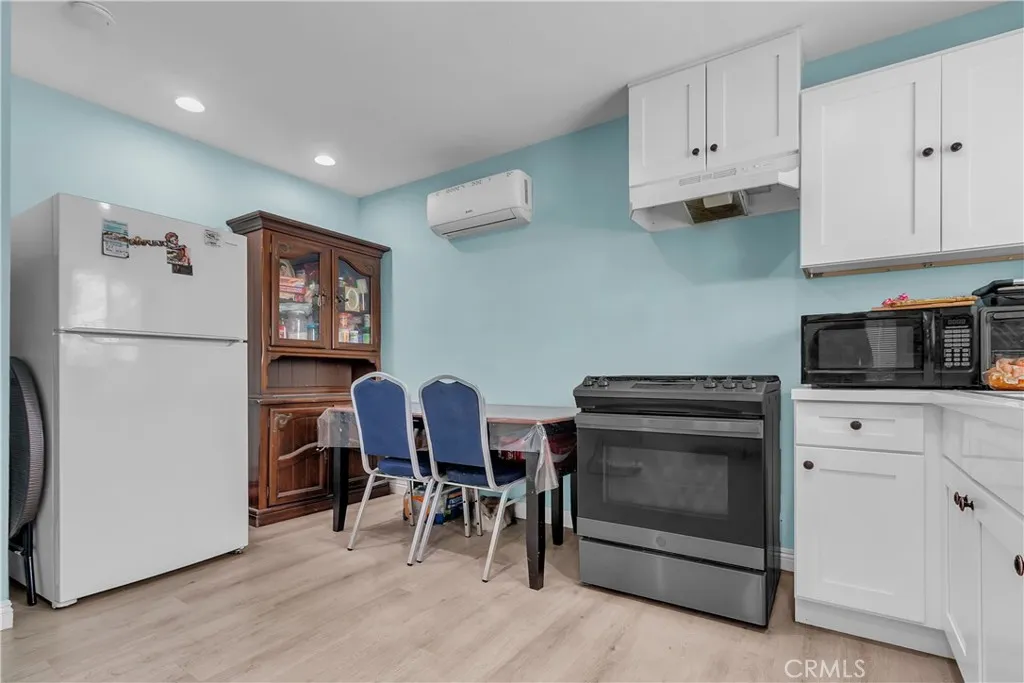 3738 Ahern Drive Baldwin Park, CA 91706 - Photo 27 of 36 a kitchen with stainless steel appliances granite countertop a refrigerator and a stove top oven