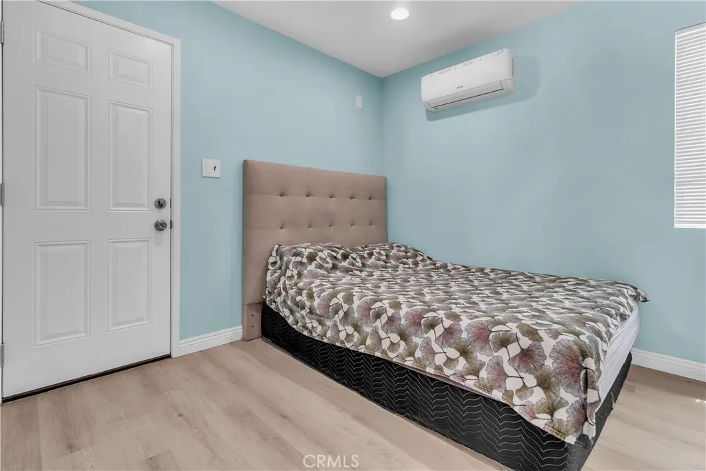 3738 Ahern Drive Baldwin Park, CA 91706 - Photo 29 of 36 a large bed sitting in a bedroom next to a cabinet