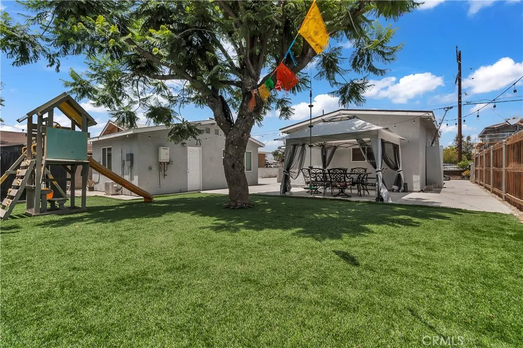 3738 Ahern Drive Baldwin Park, CA 91706 - Photo 32 of 36 a view of a house with a yard