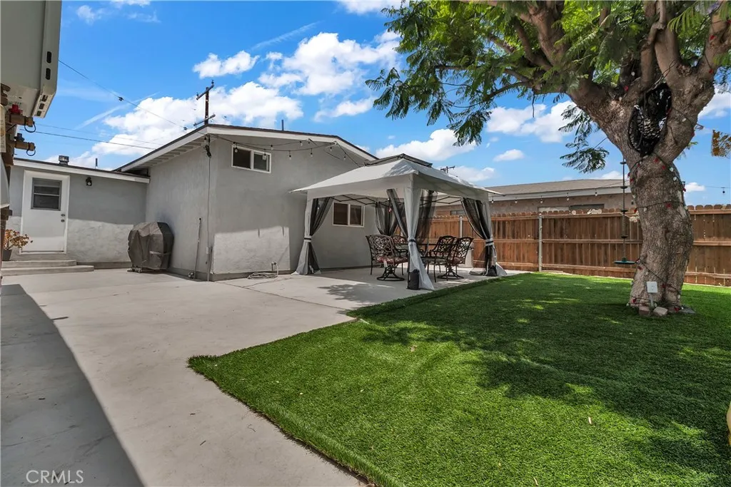 3738 Ahern Drive Baldwin Park, CA 91706 - Photo 34 of 36 a front view of a house with a garden and patio