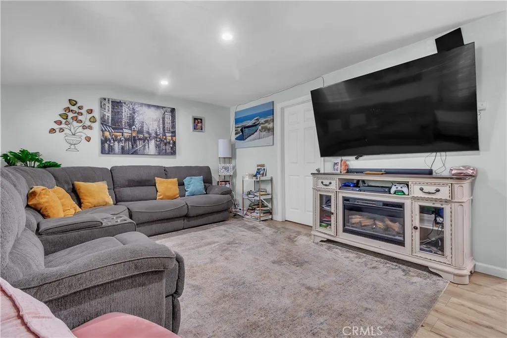3738 Ahern Drive Baldwin Park, CA 91706 - Photo 9 of 36 a living room with furniture and a flat screen tv
