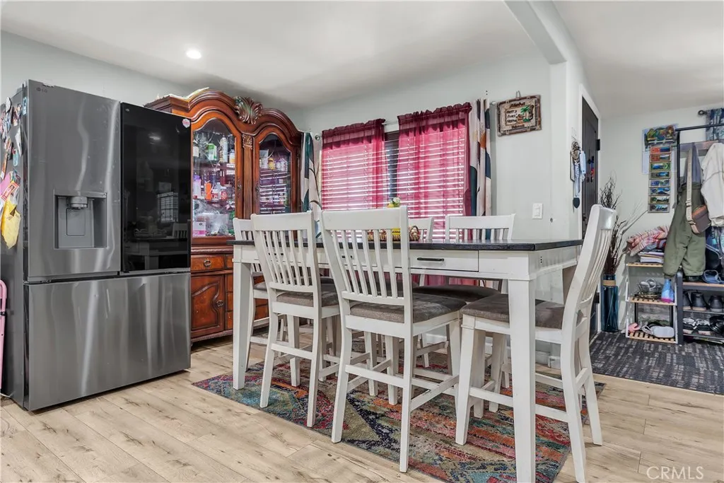 3738 Ahern Drive Baldwin Park, CA 91706 - Photo 10 of 36 a view of a kitchen with stainless steel appliances granite countertop a table and chairs
