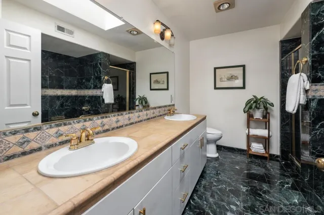 a view of balcony with furniture and potted plants