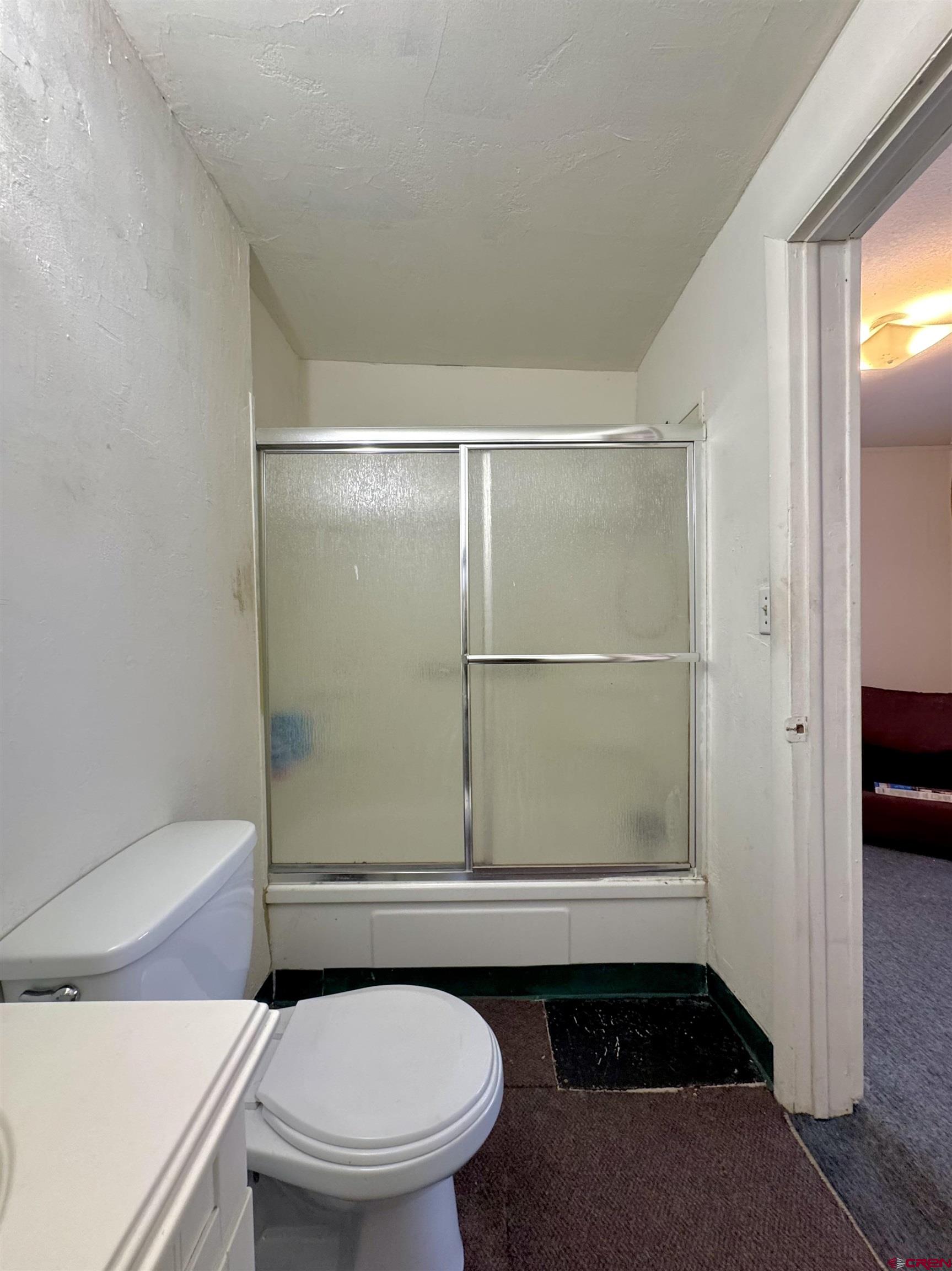 420 North 5th Street Manassa, CO 81141 - Photo 13 of 21 a bathroom with a toilet and a shower