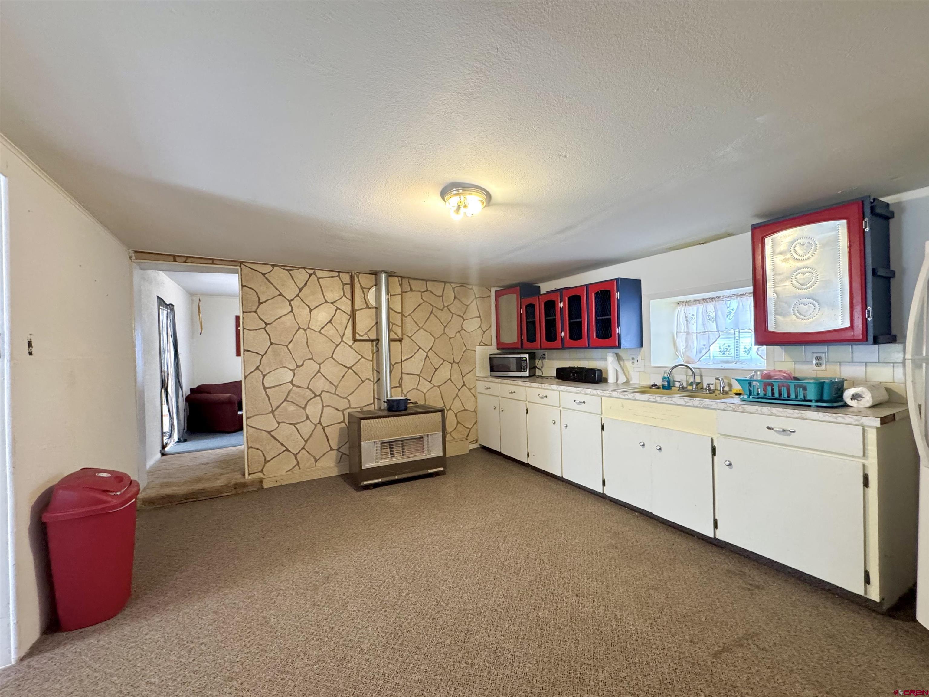 420 North 5th Street Manassa, CO 81141 - Photo 4 of 21 a room with furniture a flat screen tv and window