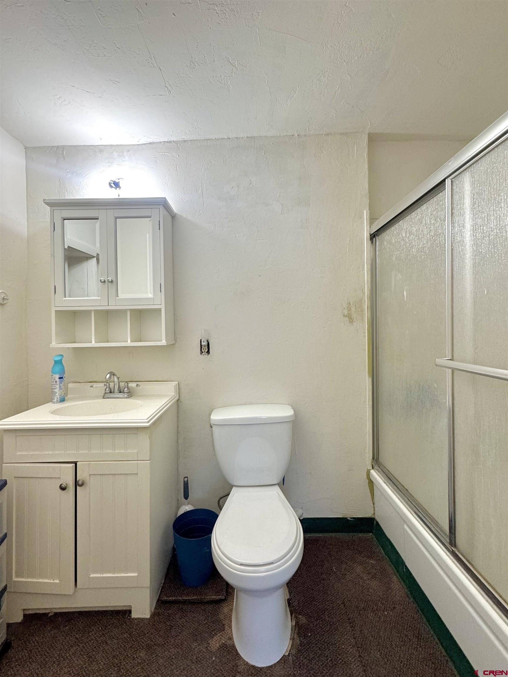420 North 5th Street Manassa, CO 81141 - Photo 6 of 21 a bathroom with a toilet sink and mirror