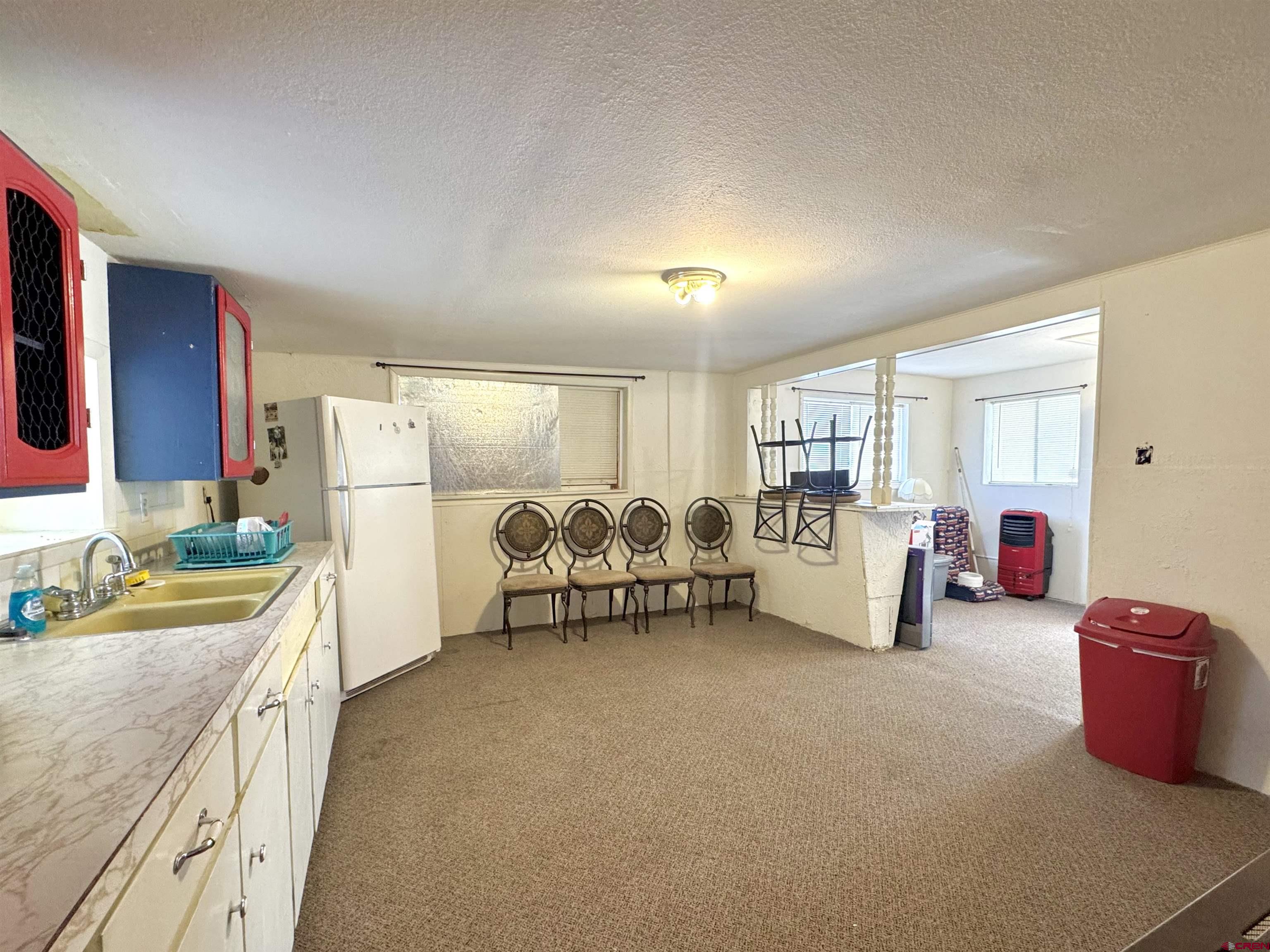 420 North 5th Street Manassa, CO 81141 - Photo 9 of 21 a spacious bedroom with furniture and a large window