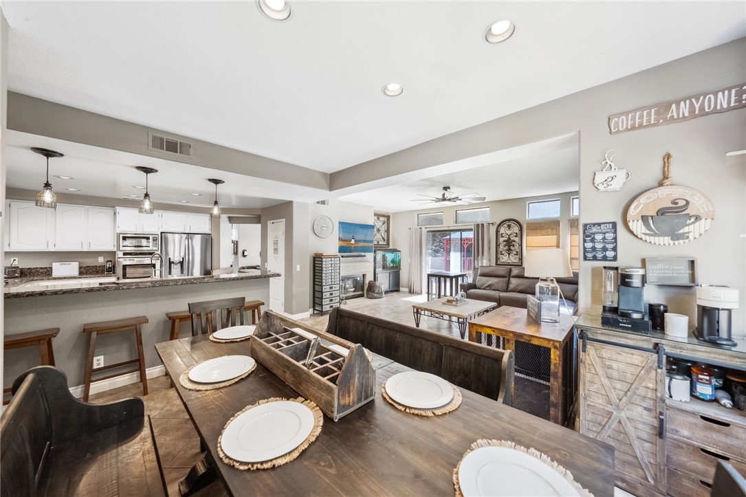 3270 Star Canyon Circle Corona, CA 92882 - Photo 21 of 55 a dining room with furniture and view kitchen