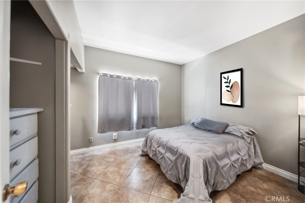 3270 Star Canyon Circle Corona, CA 92882 - Photo 22 of 55 a bedroom with a large bed and a chandelier