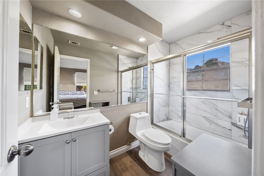 3270 Star Canyon Circle Corona, CA 92882 - Photo 45 of 55 a bathroom with a double vanity sink toilet mirror and shower