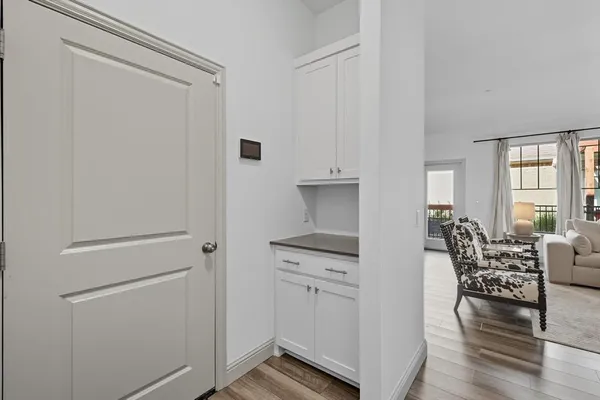 a view of kitchen with furniture and wooden floor