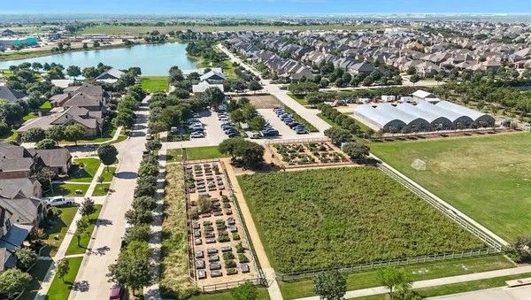 an aerial view of a house with a lake view