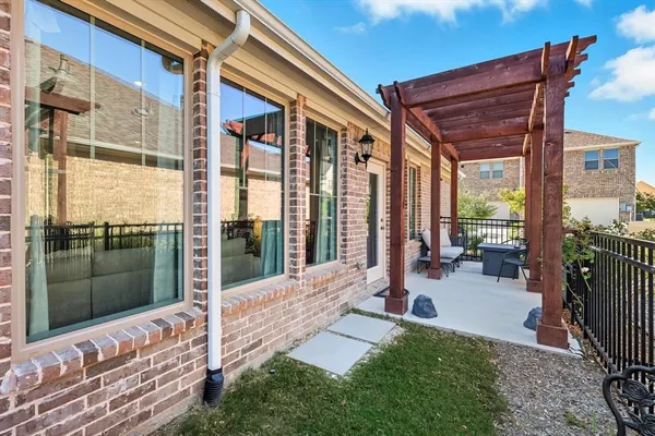 a view of a porch with furniture and front door