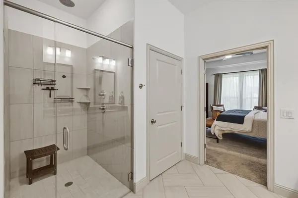 a bathroom with a tub and shower