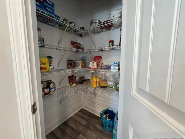 a kitchen with lots of bottles of alcohol