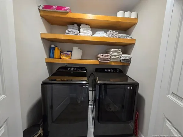 a utility room with washer and dryer