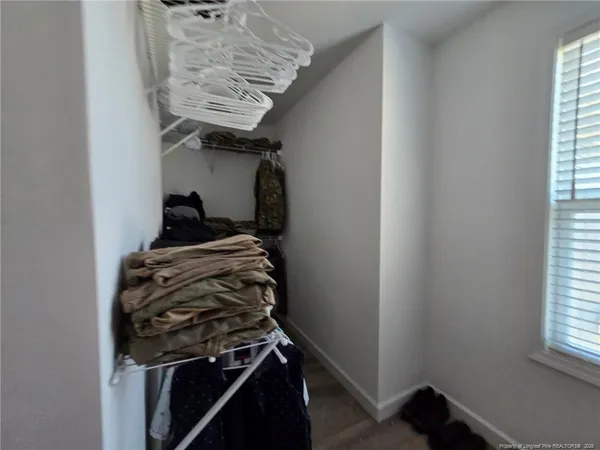 a kitchen with a stove and a window