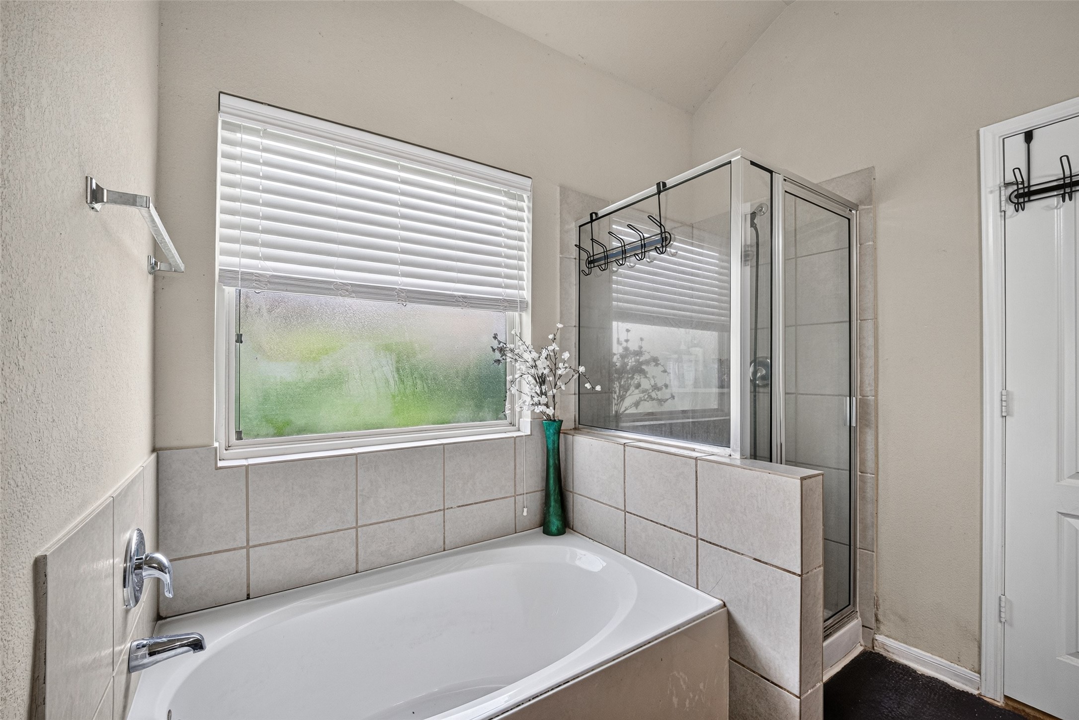 9314 Fuqua Ridge Lane Houston, TX 77075 - Photo 22 of 24 a bathroom with a tub and a large window