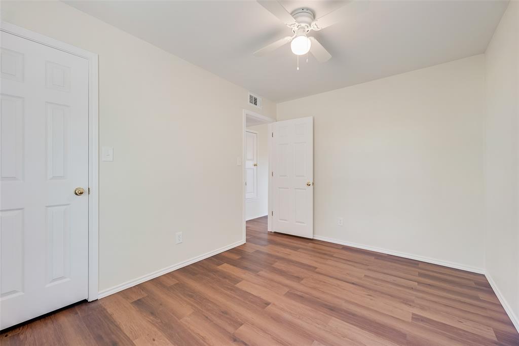 751 County Road 1240 Mount Pleasant, TX 75455 - Photo 24 of 35 a view of an empty room with wooden floor