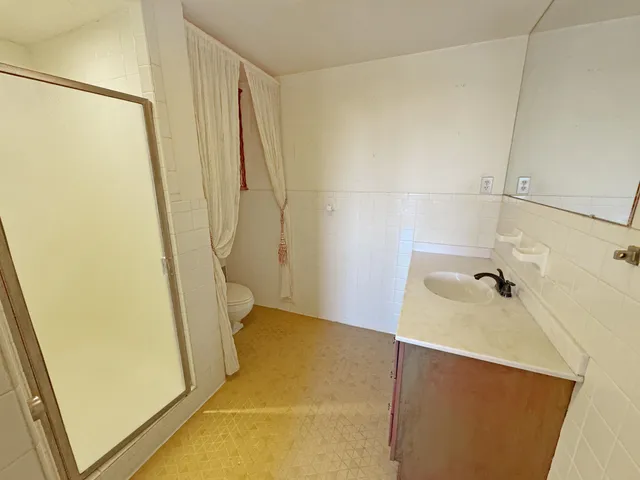 a bathroom with a tub and shower