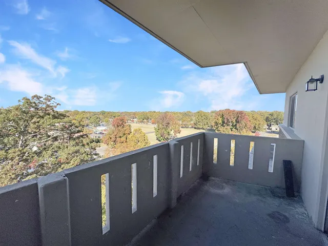 a view of a balcony with city view
