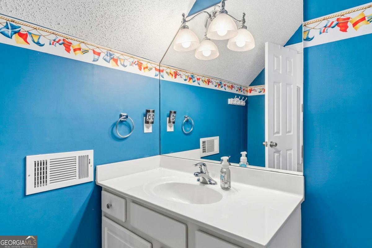 172 Mays Road Milledgeville, GA 31061 - Photo 36 of 54 a bathroom with a sink and a mirror