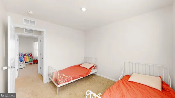 an empty room with a book shelf