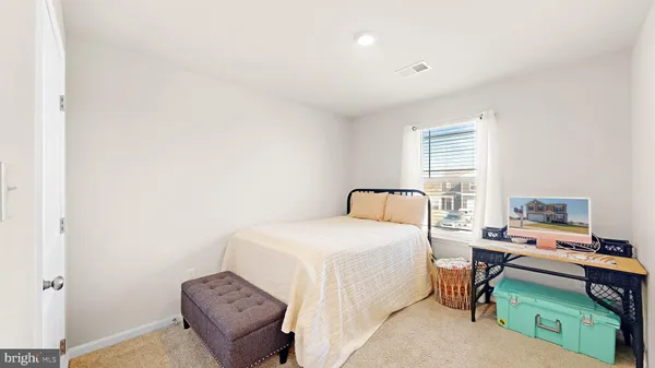 a bedroom with a bed and a tv