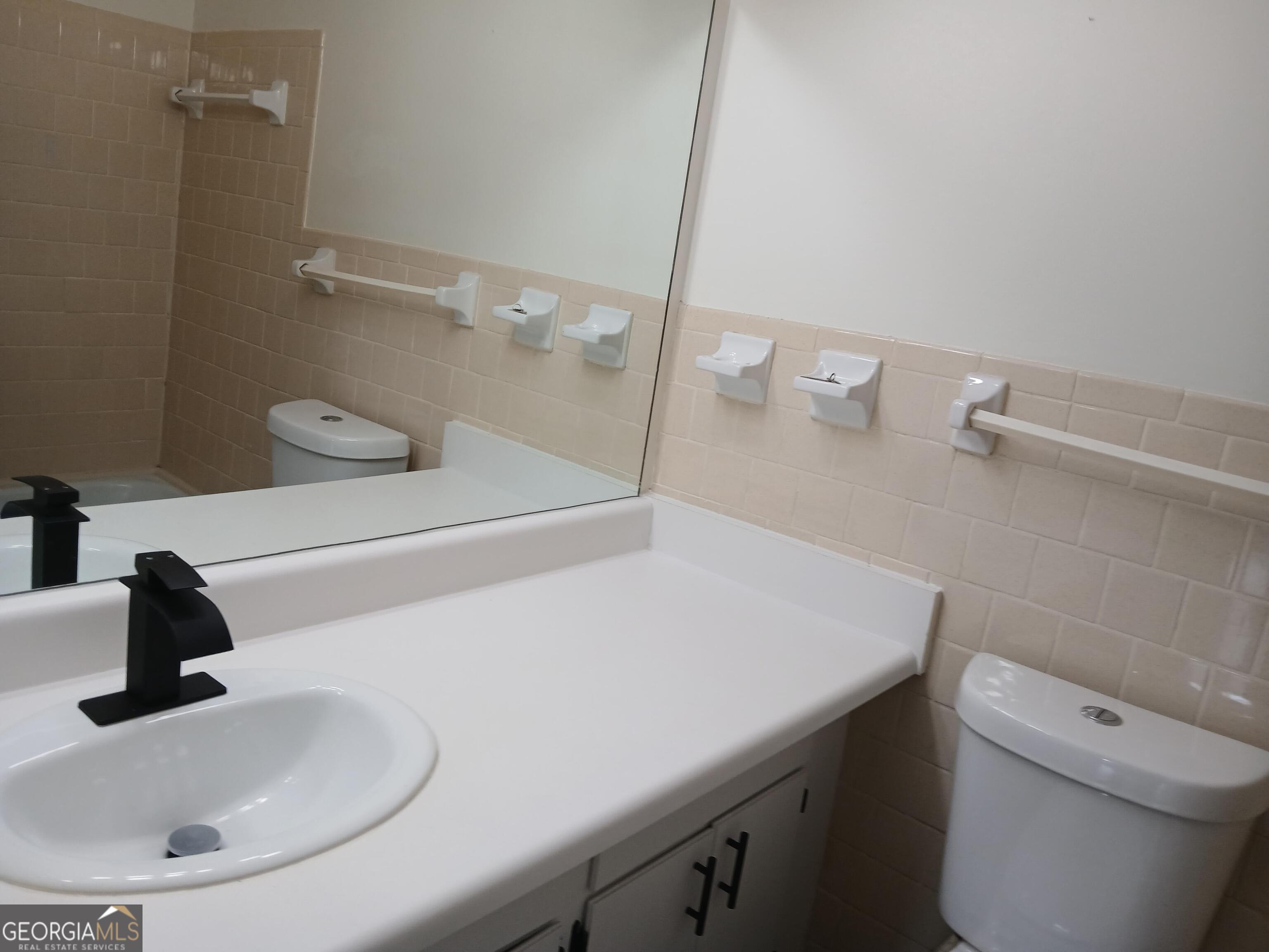 2805 Northeast Expressway Northeast, Unit B18 Atlanta, GA 30345 - Photo 11 of 13 a bathroom with a sink and a toilet