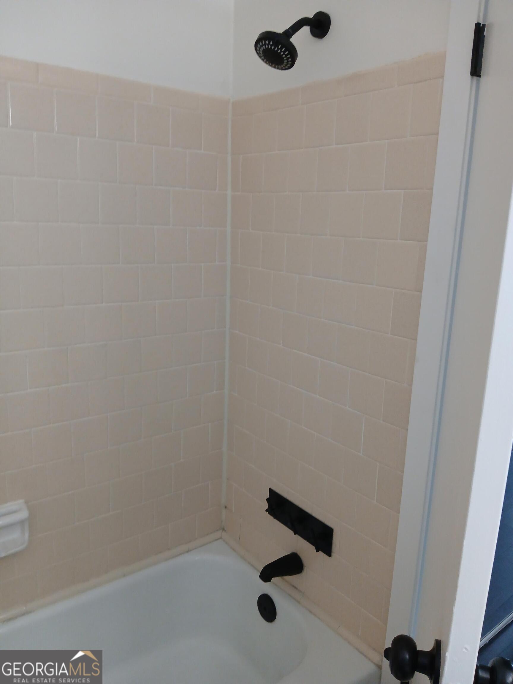 2805 Northeast Expressway Northeast, Unit B18 Atlanta, GA 30345 - Photo 12 of 13 a bathroom with a shower