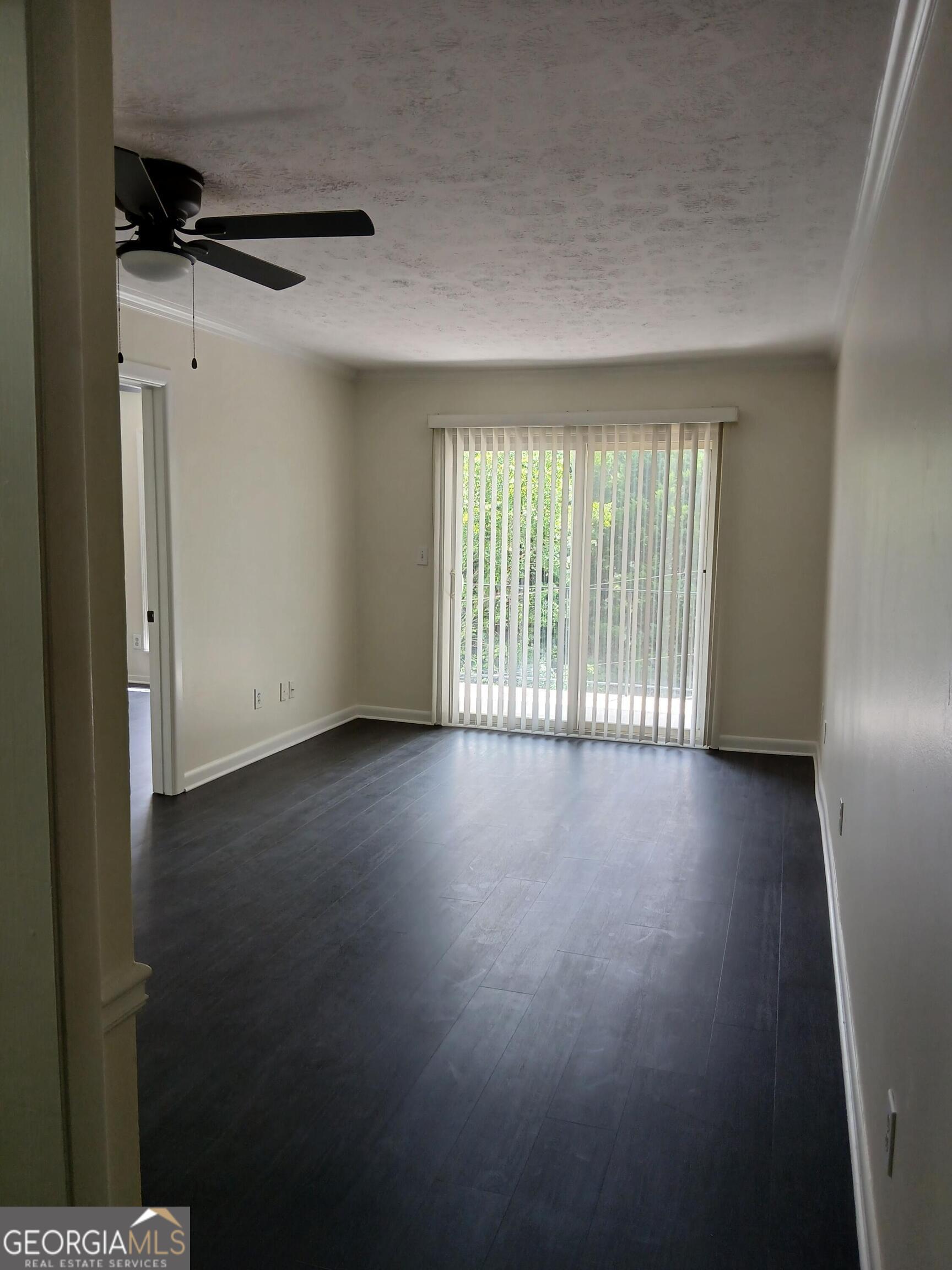 2805 Northeast Expressway Northeast, Unit B18 Atlanta, GA 30345 - Photo 2 of 13 a view of livingroom with hardwood floor and window