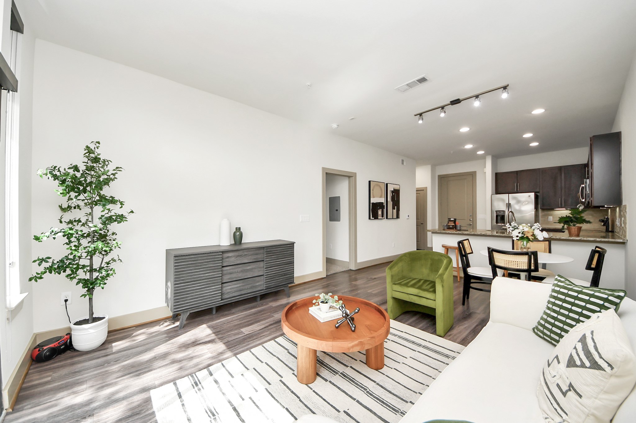 3800 Main Street, Unit 1 226 Houston, TX 77002 - Photo 32 of 50 a living room with furniture and a wooden floor