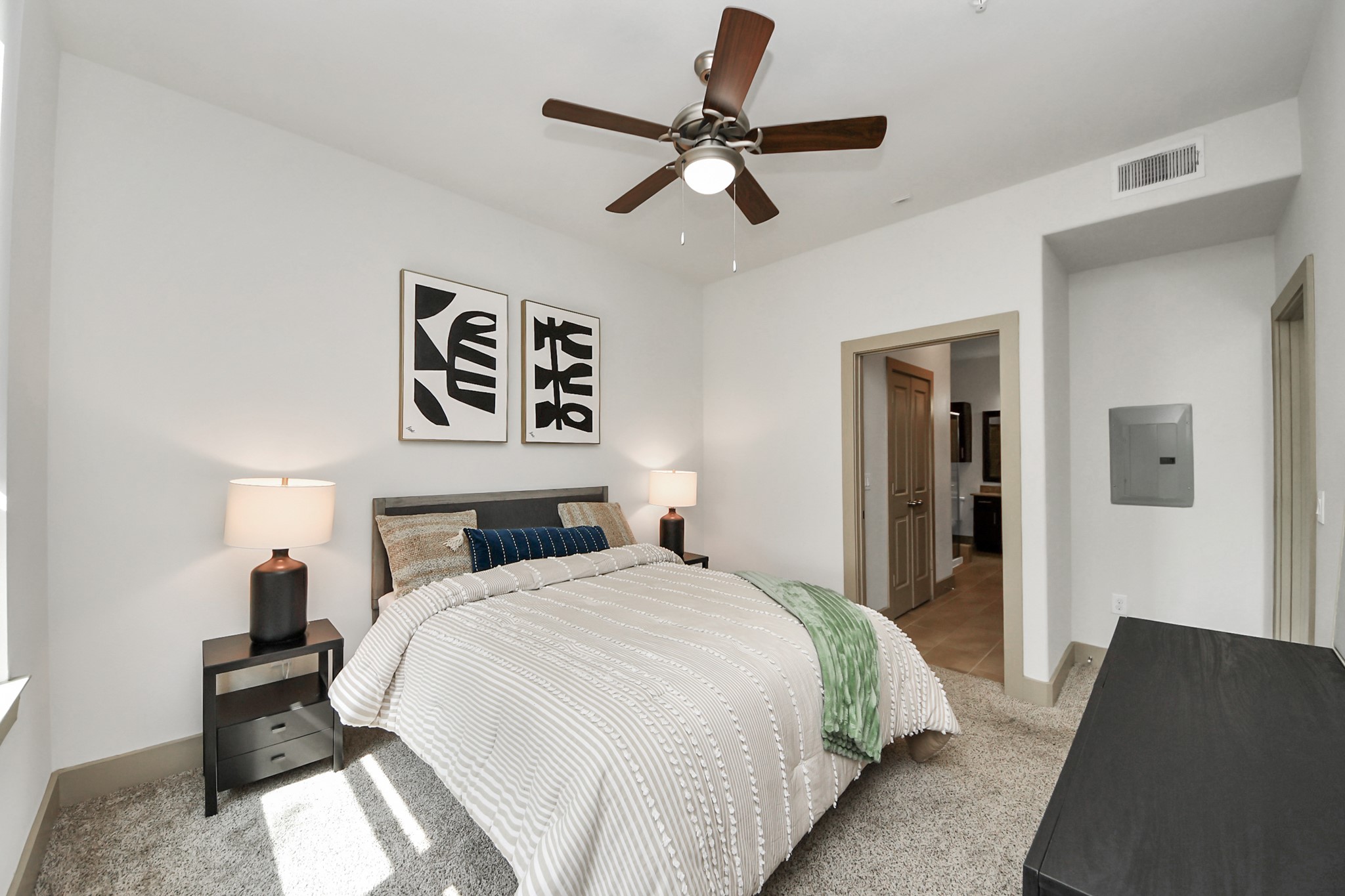 3800 Main Street, Unit 1 226 Houston, TX 77002 - Photo 37 of 50 a bedroom with a bed and a lamp on the dresser