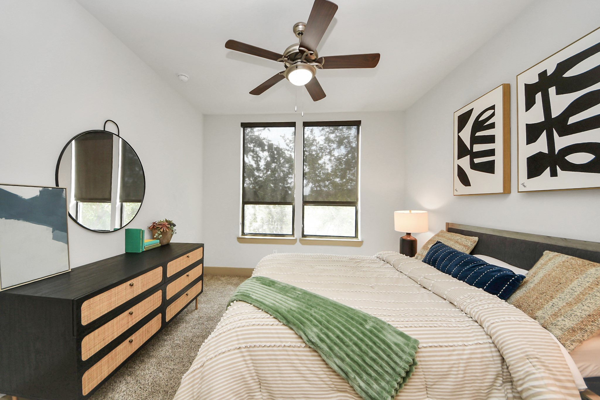 3800 Main Street, Unit 1 226 Houston, TX 77002 - Photo 39 of 50 a bedroom with a bed a mirror and a large window