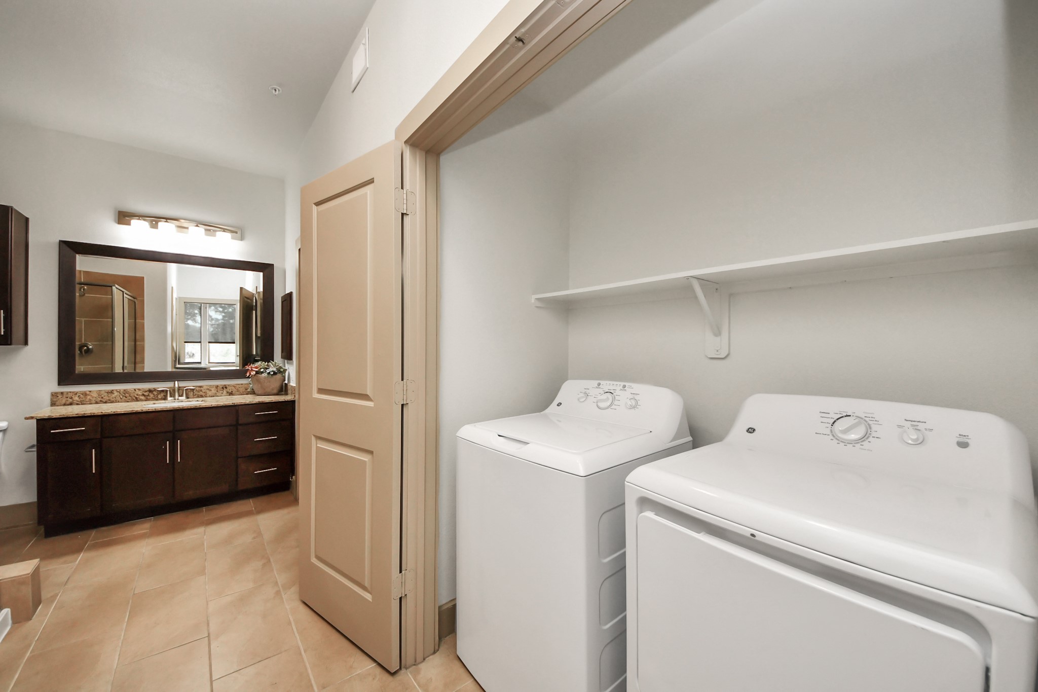3800 Main Street, Unit 1 226 Houston, TX 77002 - Photo 42 of 50 a view of washer and dryer with a view of kitchen