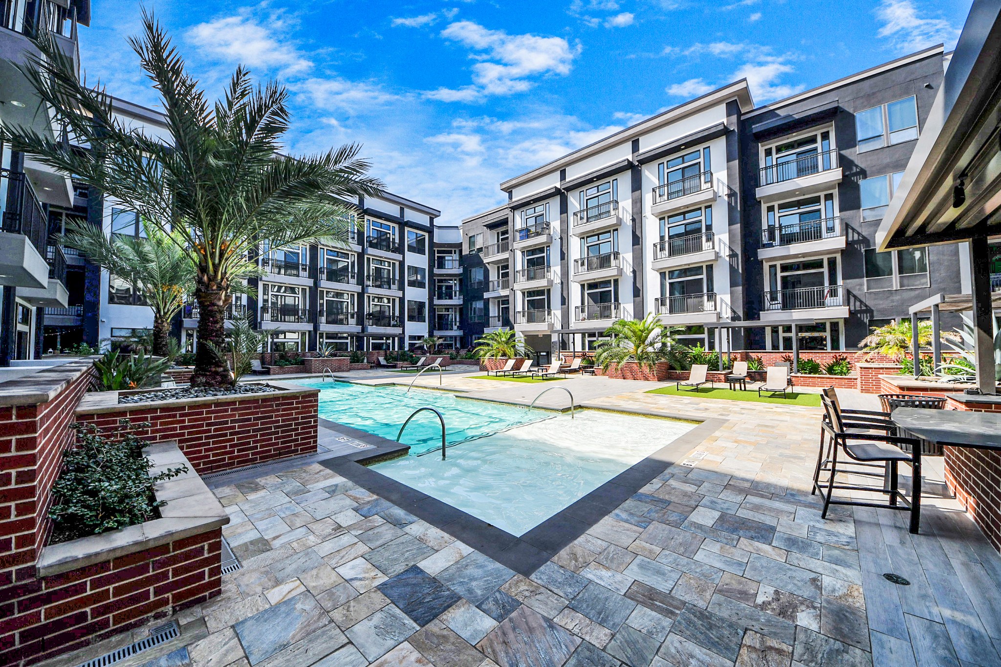 3800 Main Street, Unit 1 226 Houston, TX 77002 - Photo 49 of 50 a swimming pool with outdoor seating and yard