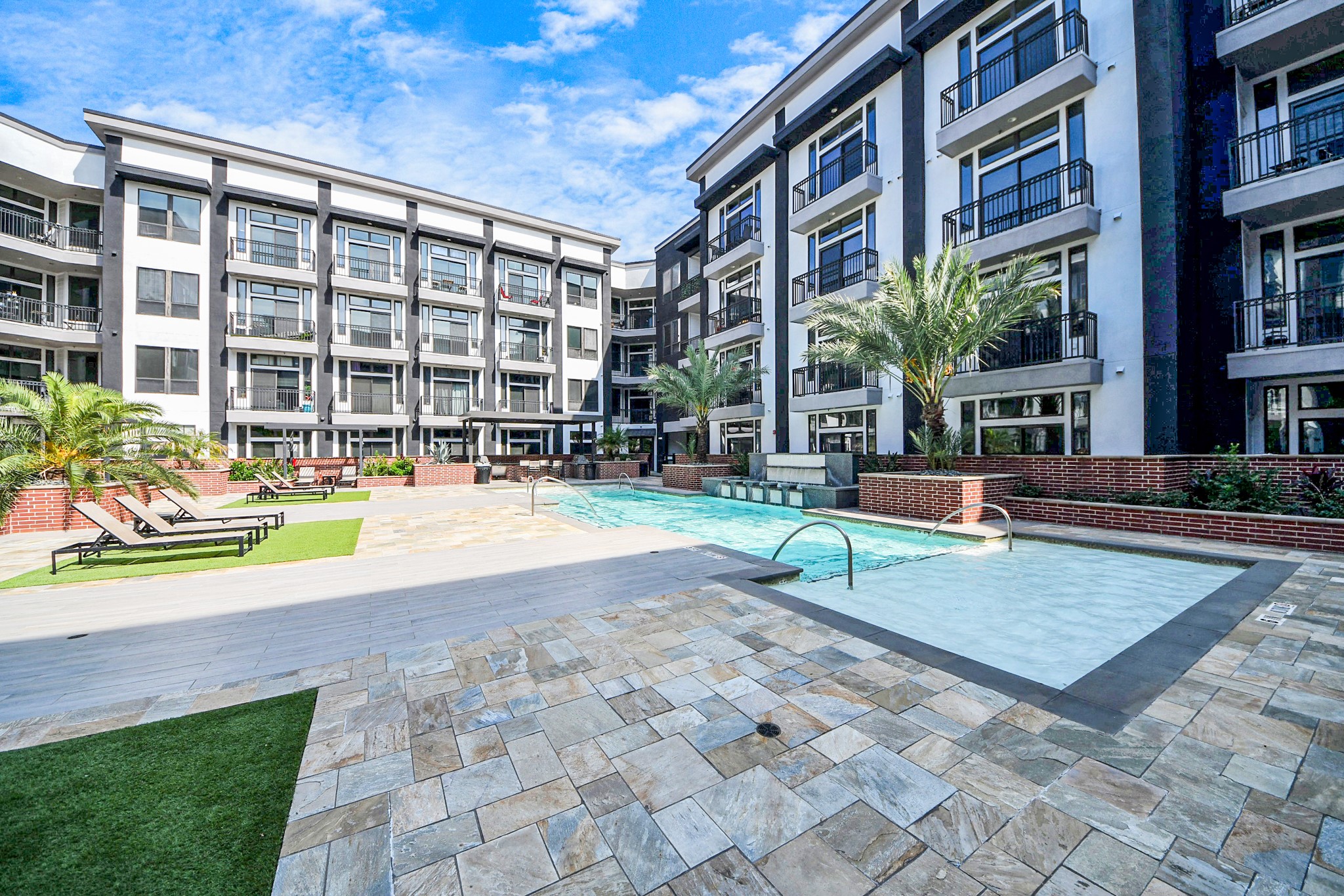 3800 Main Street, Unit 1 226 Houston, TX 77002 - Photo 4 of 50 a view of tall building with a bench and trees