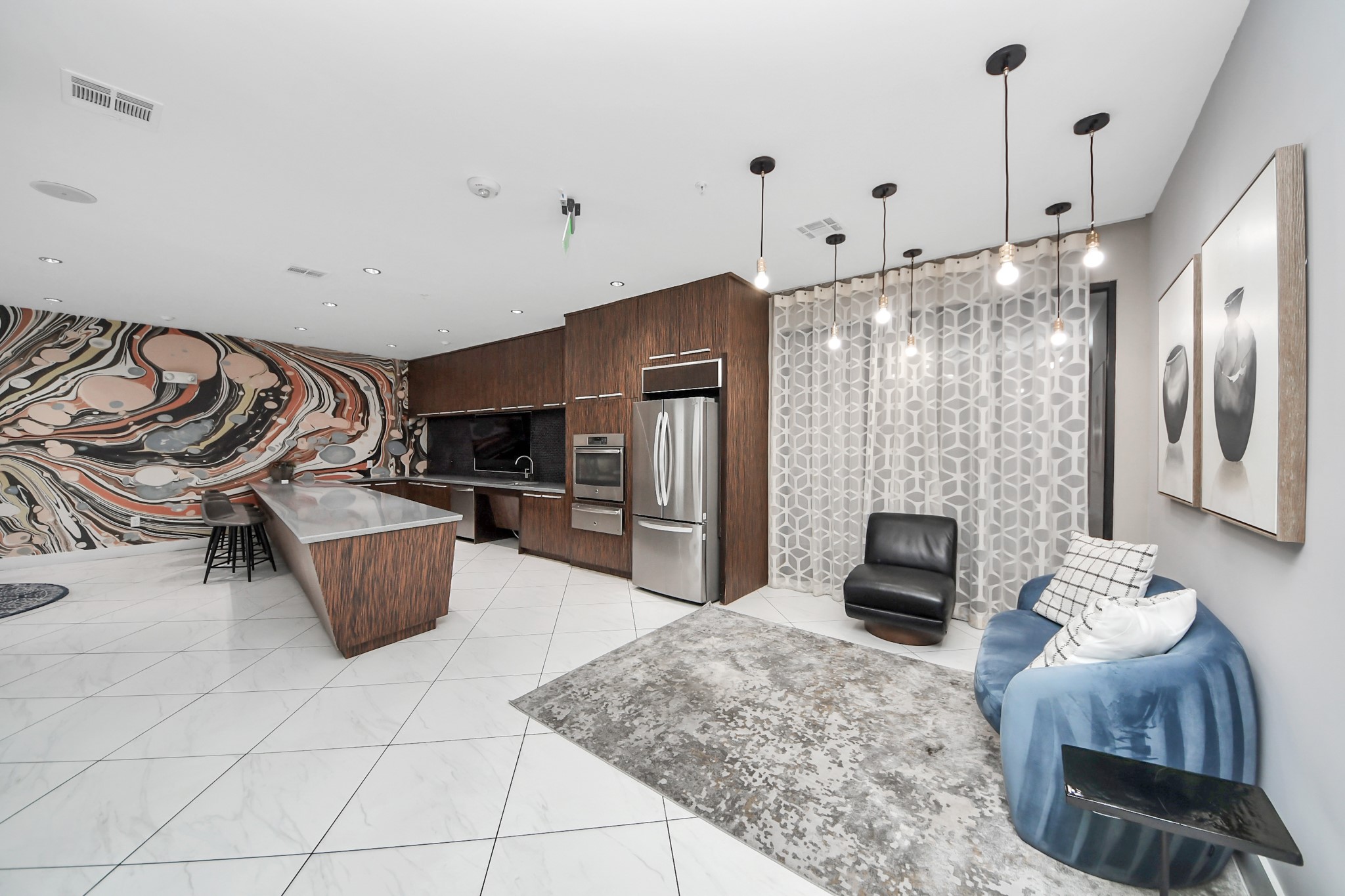3800 Main Street, Unit 1 226 Houston, TX 77002 - Photo 11 of 50 a kitchen with stainless steel appliances kitchen island granite countertop a refrigerator and a stove top oven