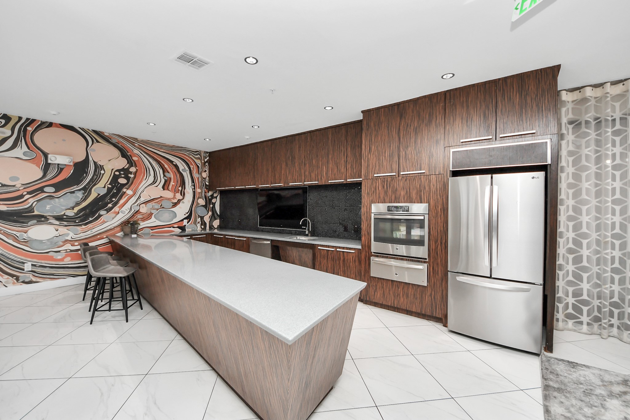 3800 Main Street, Unit 1 226 Houston, TX 77002 - Photo 12 of 50 a kitchen with stainless steel appliances a refrigerator and a stove top oven