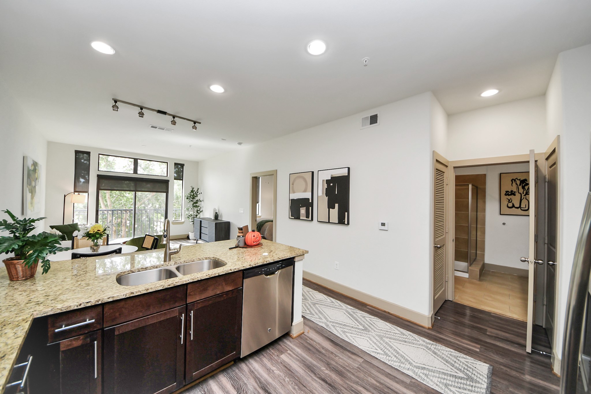 3800 Main Street, Unit 1 226 Houston, TX 77002 - Photo 25 of 50 a bathroom with a double vanity sink a mirror and a shower
