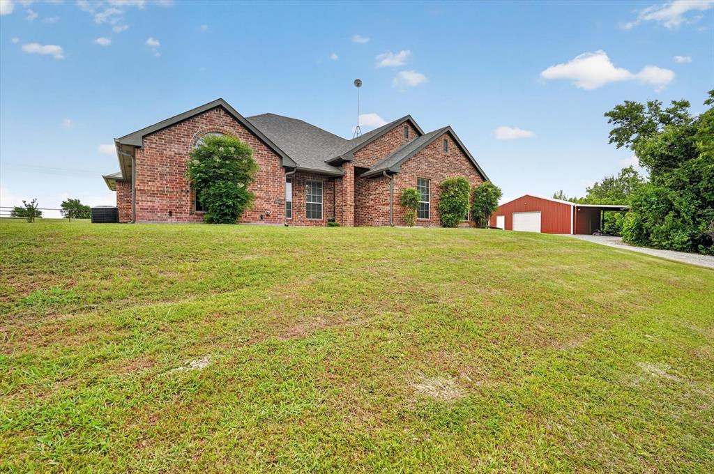 2828 Bennett Road Howe, TX 75459 - Photo 2 of 39 a view of a house with a yard and garage