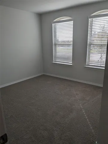 a kitchen with stainless steel appliances a refrigerator and a stove top oven