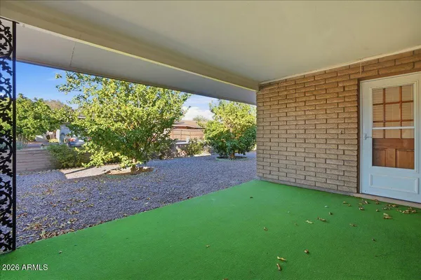 a view of a back yard from a room