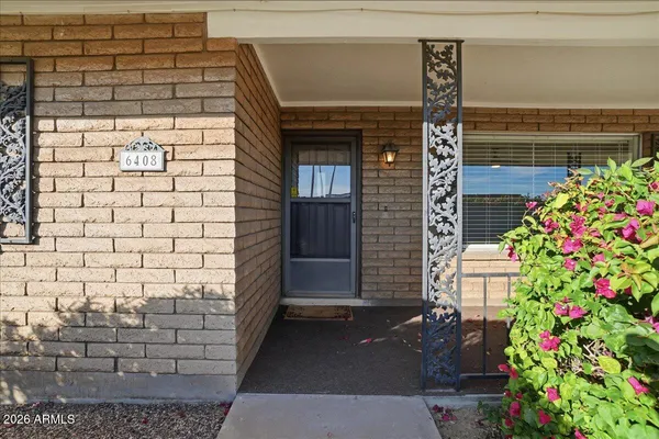 a front view of a house with garage