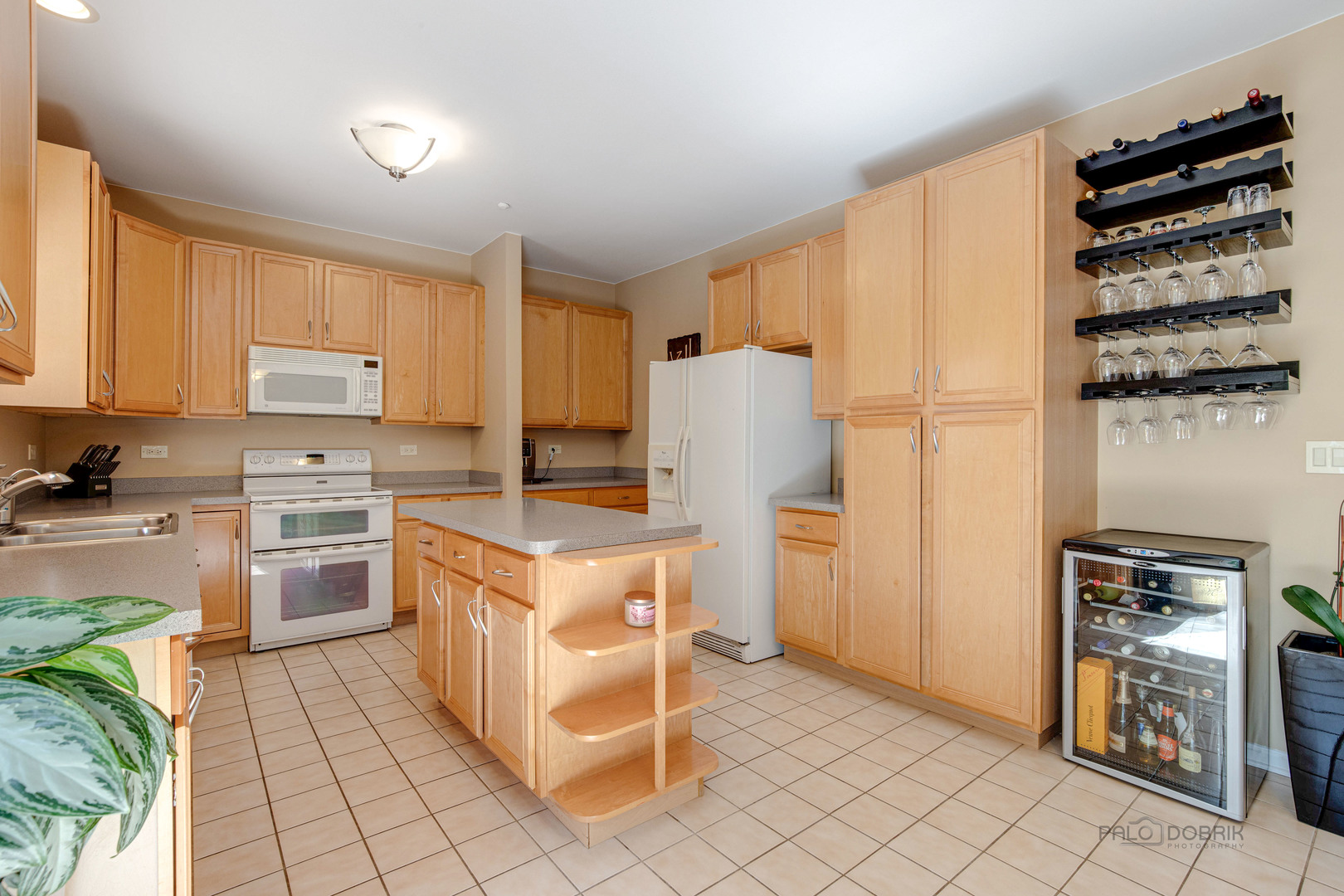 Undisclosed Address Long Grove, IL 60060 - Photo 12 of 35 a kitchen with a refrigerator and a stove top oven