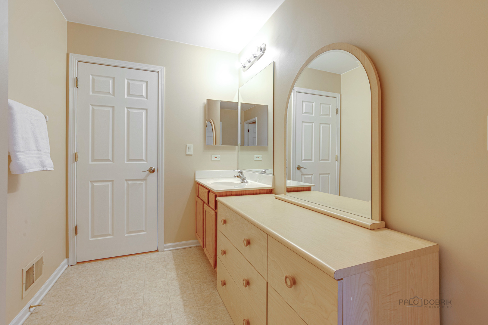 Undisclosed Address Long Grove, IL 60060 - Photo 23 of 35 a view of a bathroom with a sink and mirror