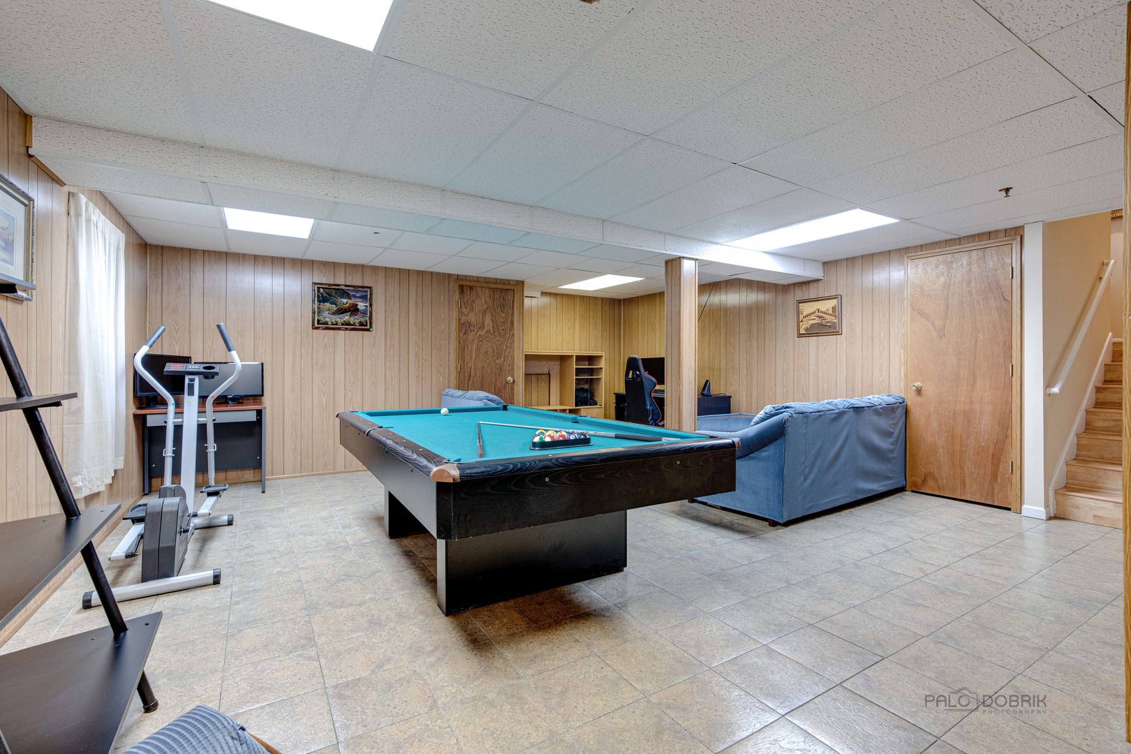 Undisclosed Address Long Grove, IL 60060 - Photo 28 of 35 a living room with furniture a flat screen tv and a table